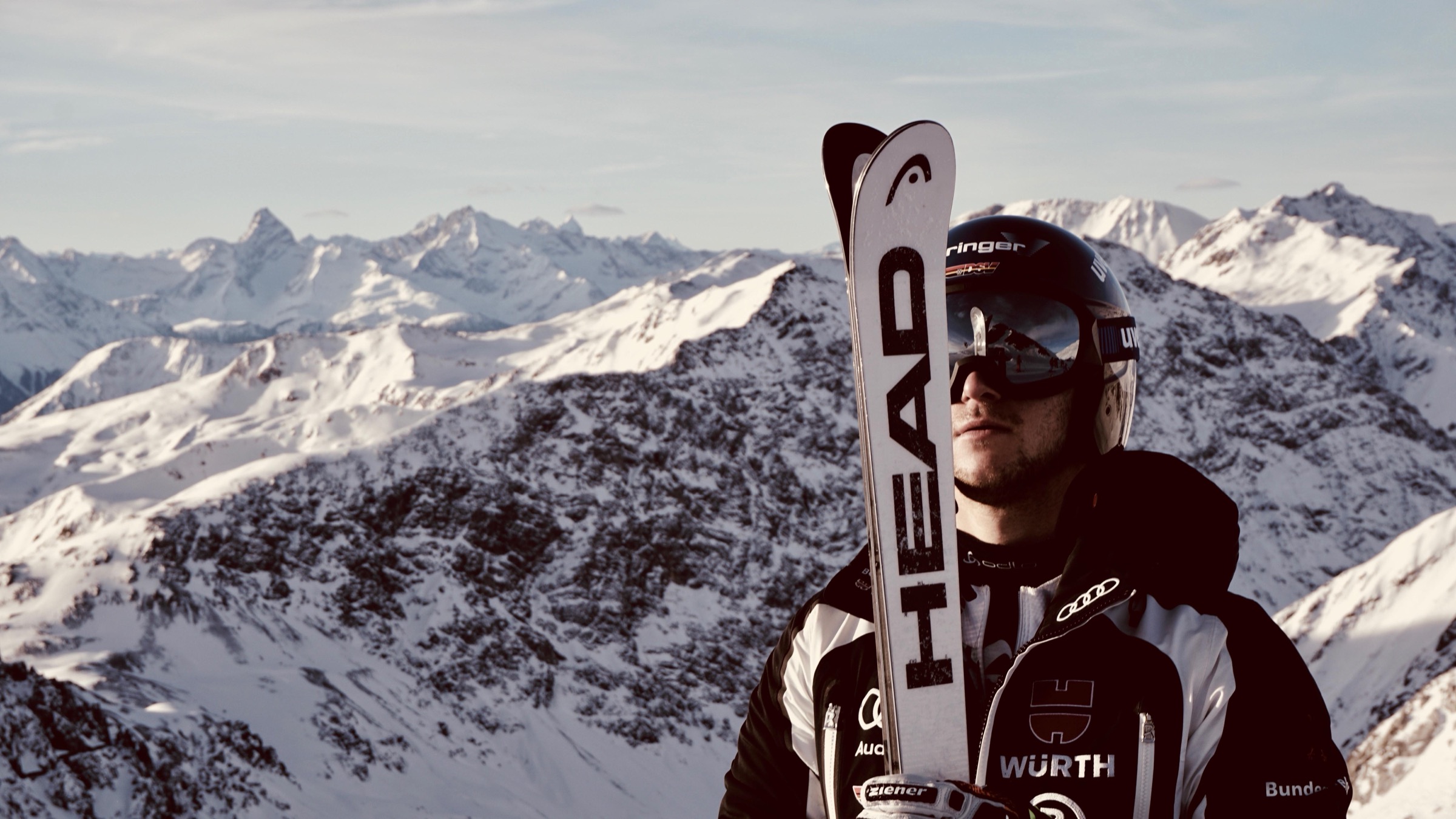 Skis framing a snow-covered mountain panorama