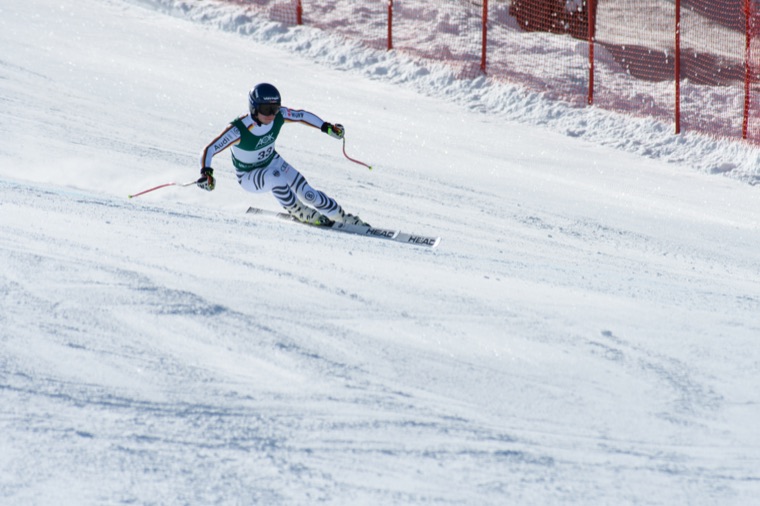 Speed turn on a wide, sunlit slope