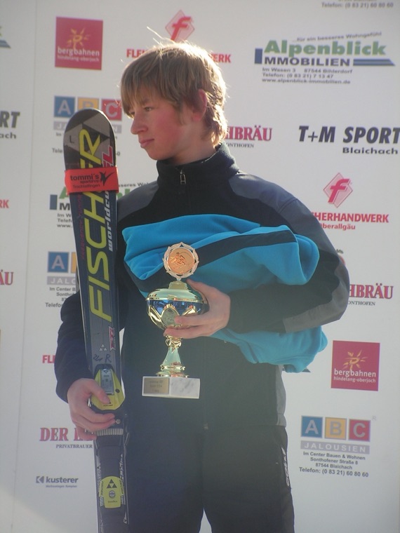 With a trophy after a youth race