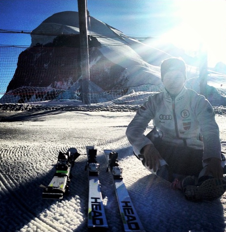 Resting in the snow next to the skis